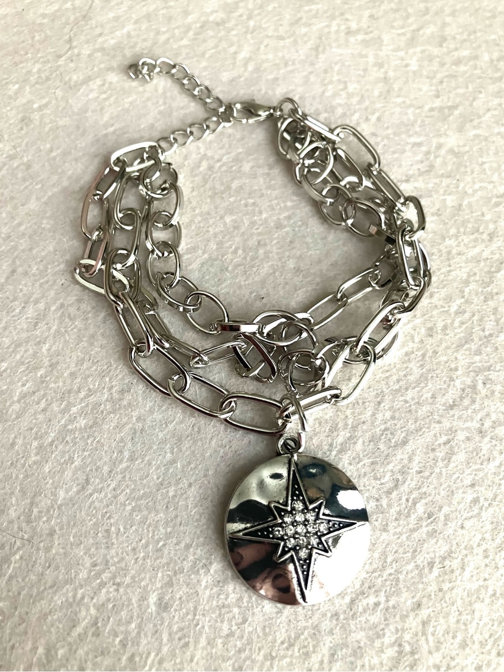 Multi chain silver star charm bracelet